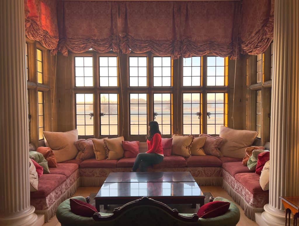 Drawing Room window seat with Bejal sitting and looking out of window