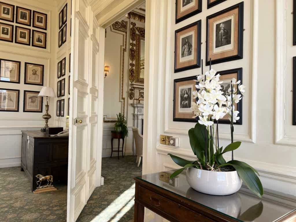 The Morning & Gilt room with paintings and orchid