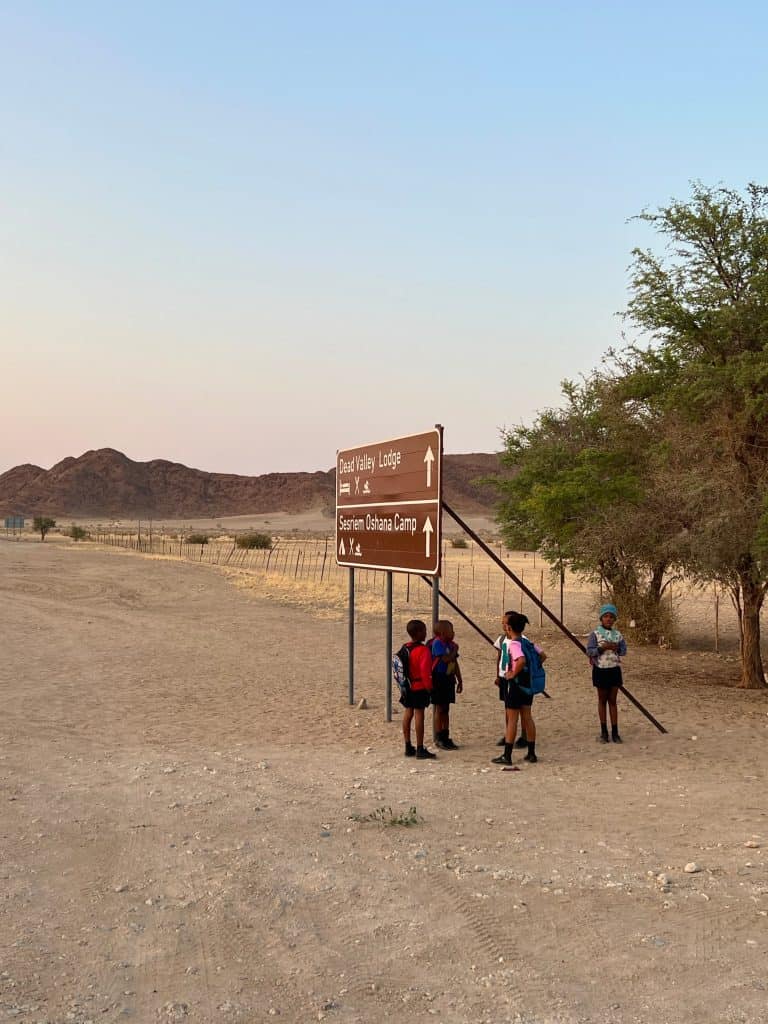 Best visit Sossusvlei: children waiting for school pick-up at Sesriem gates