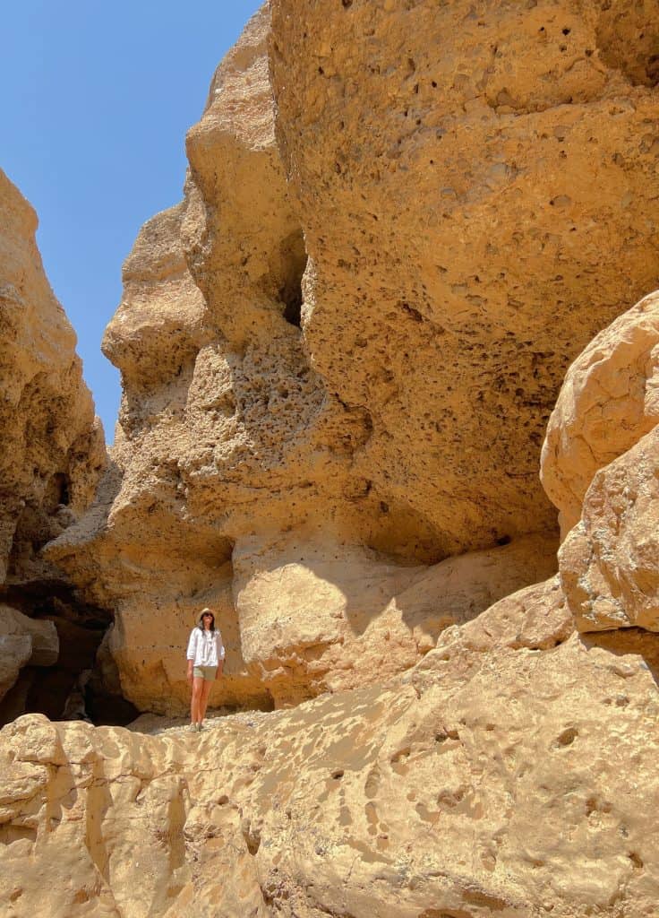 Sesriem Canyon with Bejal standing on rock