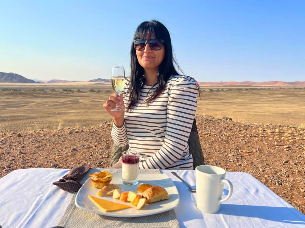 Bejal having champagne breakfast post hot air balloon flight