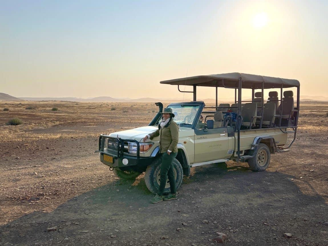 Bejal standing with Safari Car in Damaraland