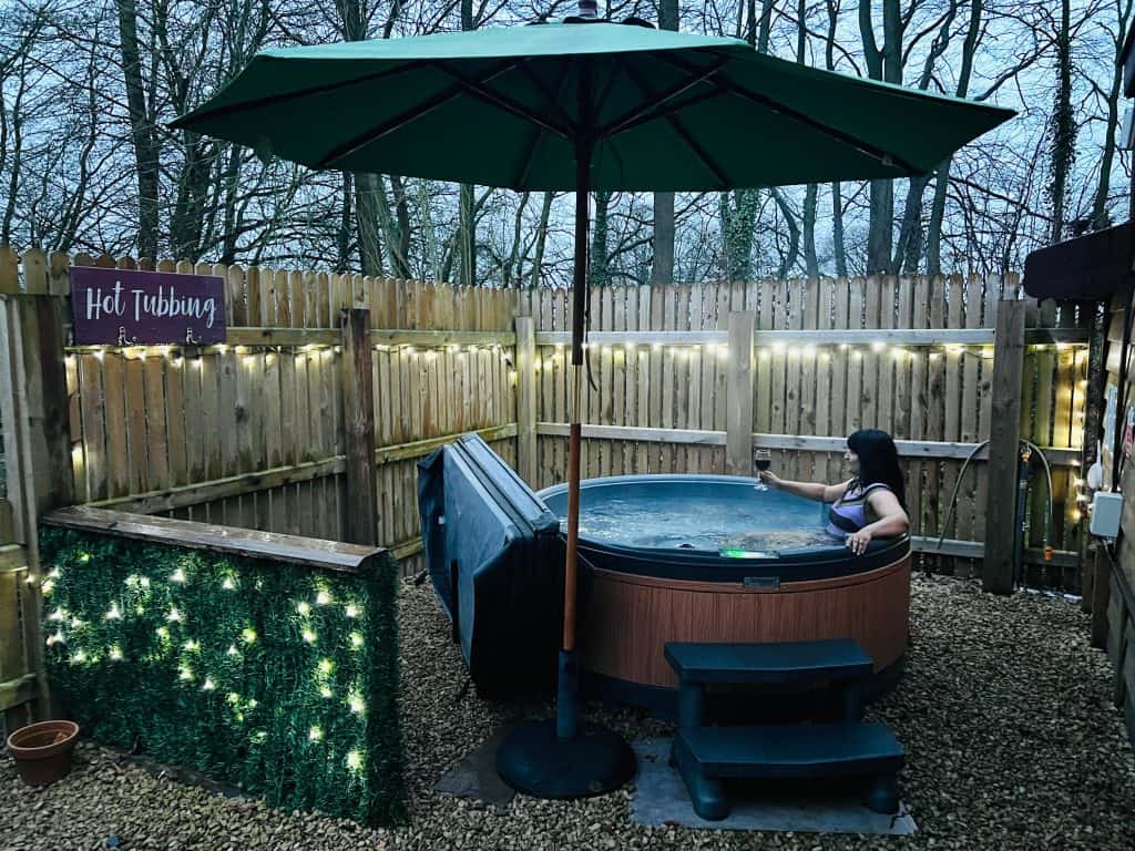 Mallory Meadows Boutique Cabin Stay: Hot tub with fairy lights on patio