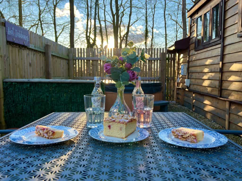 Mallory Meadows Boutique Cabin Stay: teatime treats on patio table outside cabin
