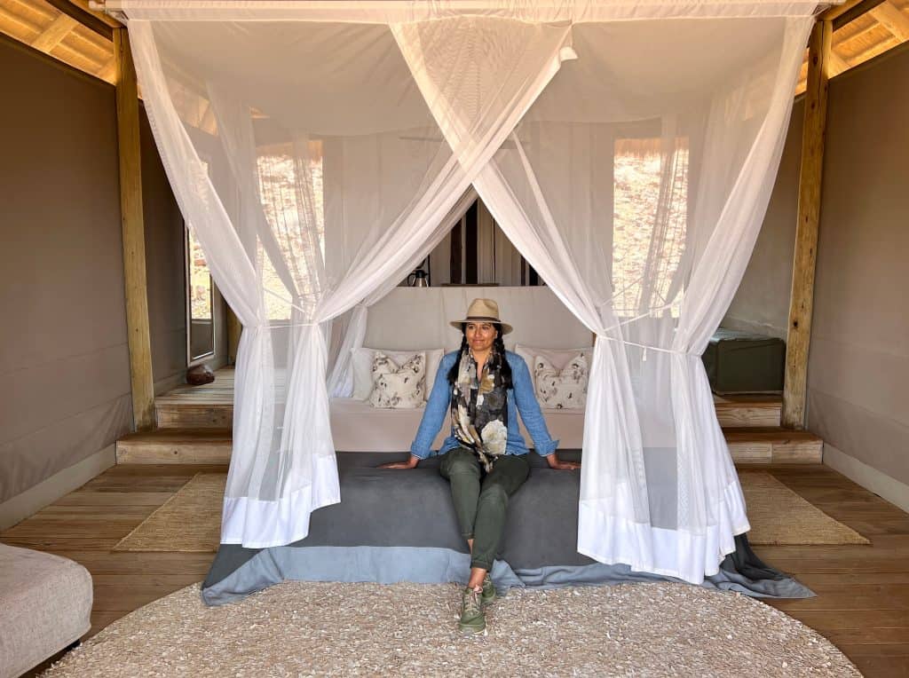 Best of Damaraland: bejal sitting on Damaraland Camp bed