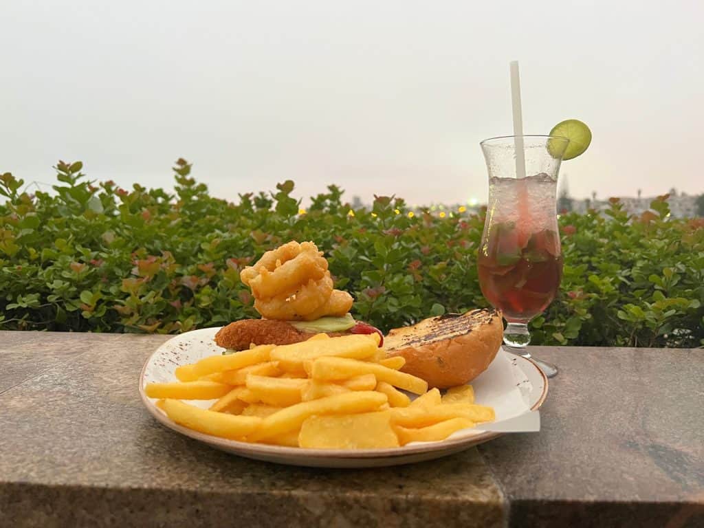 Brewer & Butcher burger with fries on terrace