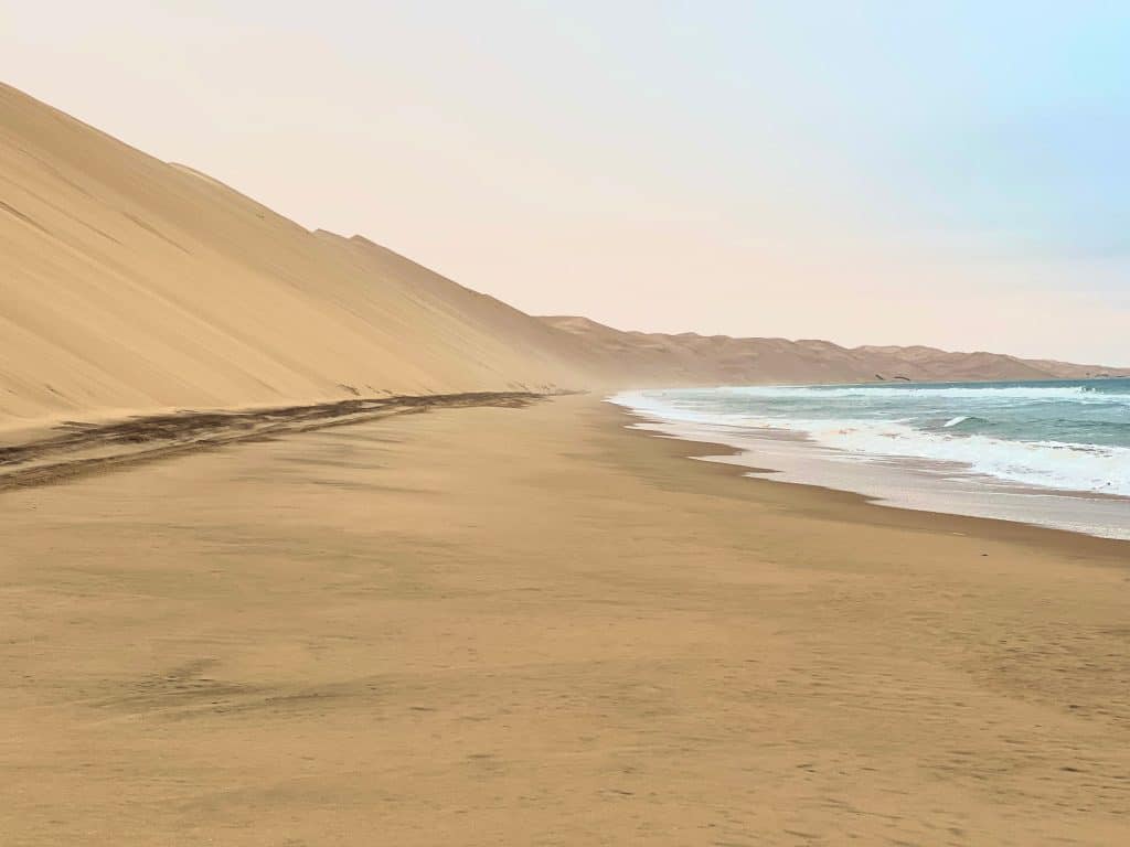 Dune and Atlantic ocean at Sandwich Harbour
