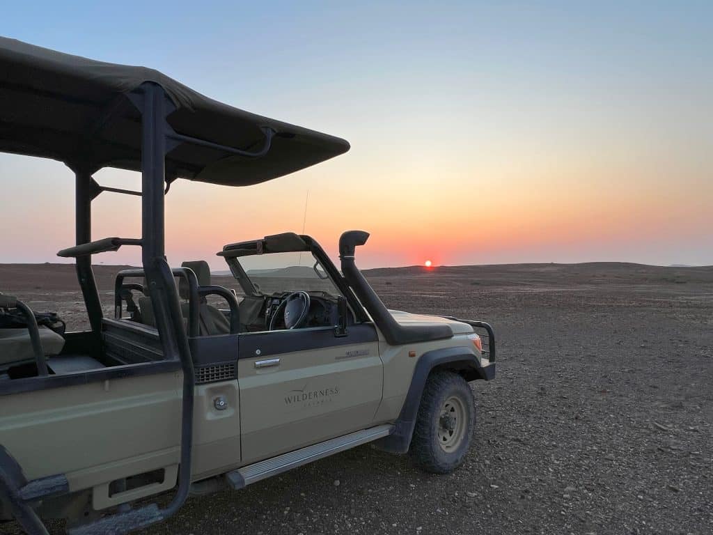Sunset  from Desert Rhino Camp with safari 4x4