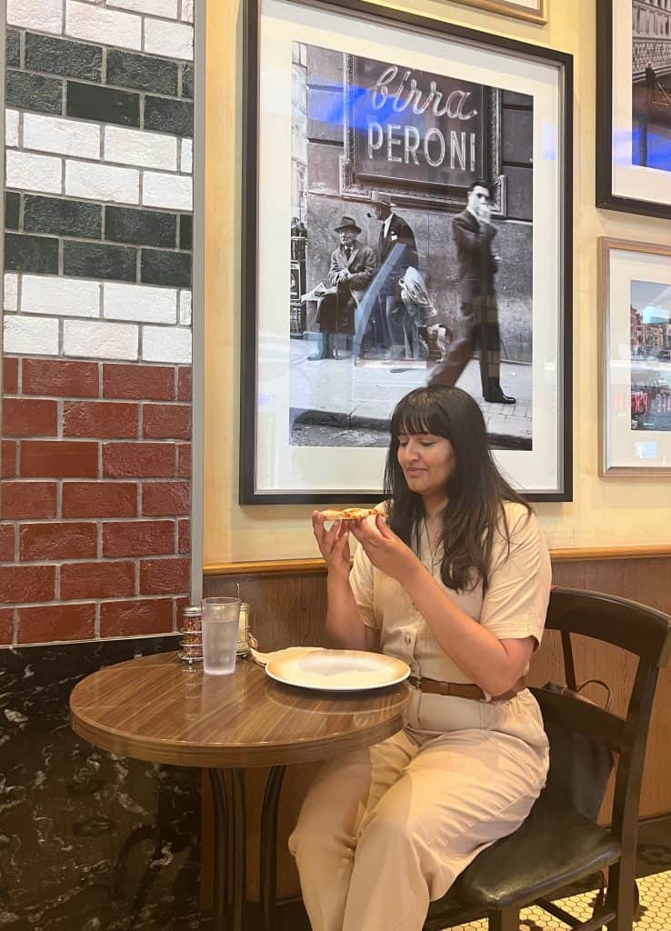 Bejal eating Margherita pizza in Sorrento's