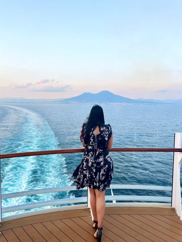 Bejal with looking out to sunset on top deck