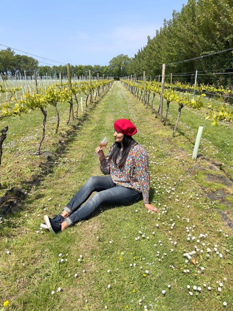 Sustainable Jersey: Bejal sitting on the ground between vines