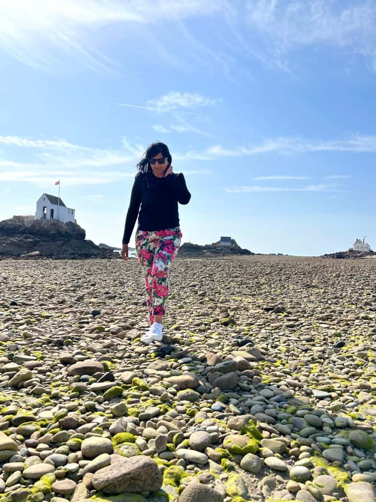Bejal walking on pebbles of Ecrehouse island