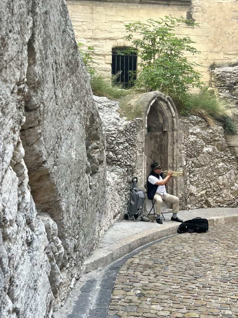 Musician in archway on Avignon historic town