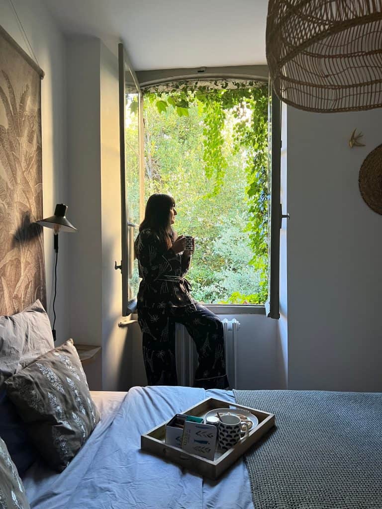 Bejal sitting in bedroom window at Le Lieu