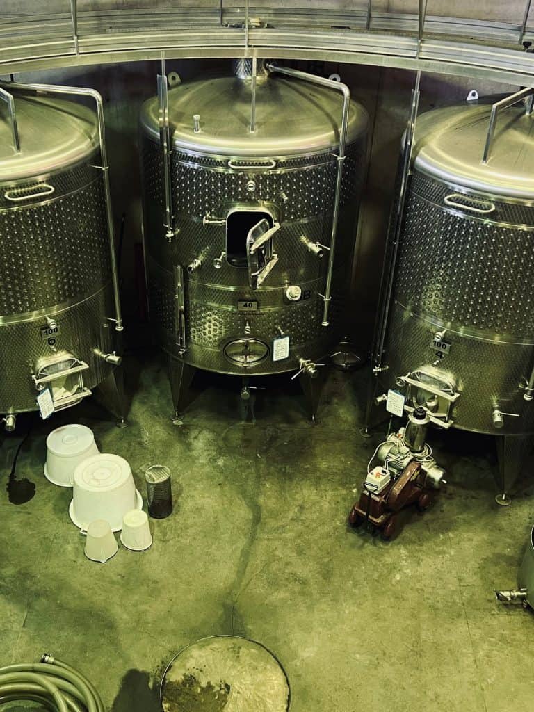 Silver vats for grape fermentation at at Domaine de Mourchon