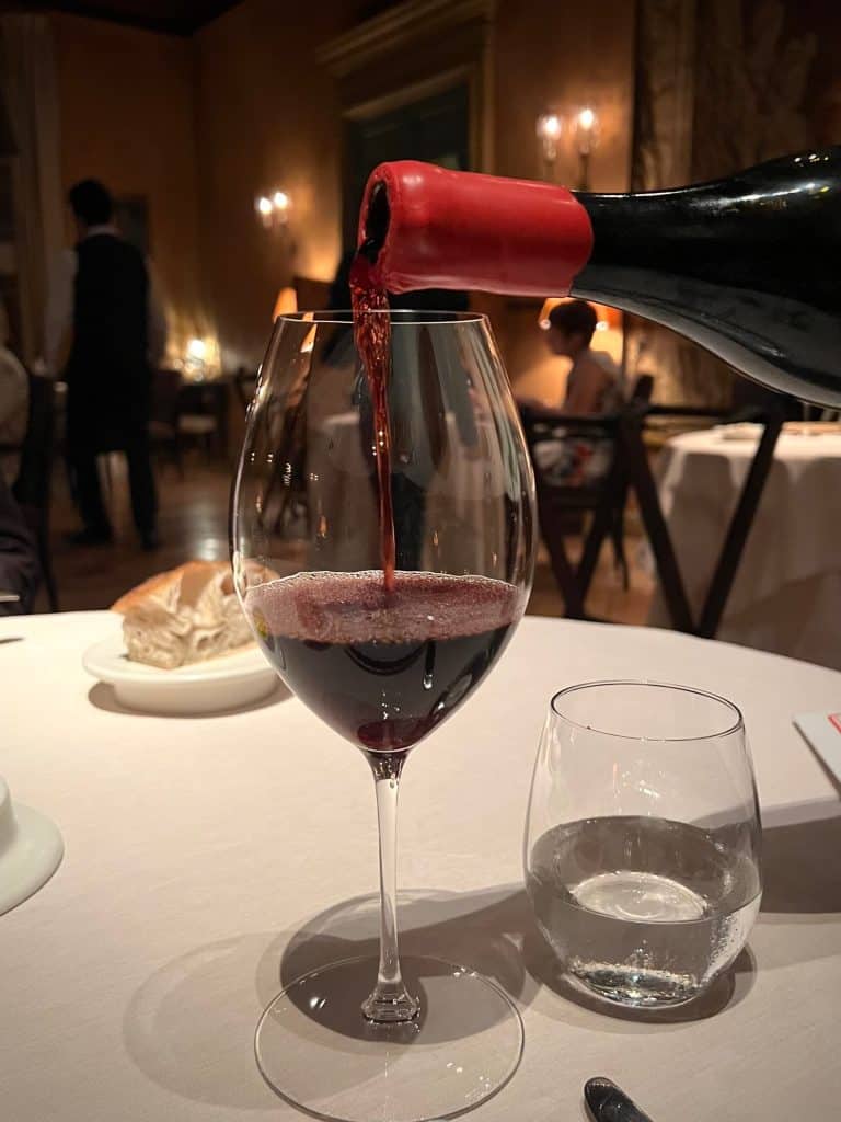 Vegetarian-Friendly Michelin-Starred Dining At La Mirande: Red Wine being poured