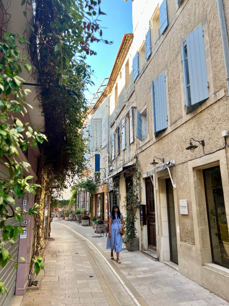 Cities and towns to visit in Provence: Bejal walking down pretty street in Saint Remy de Provence