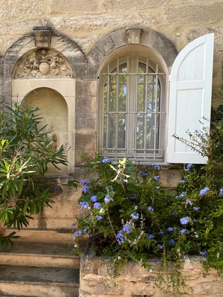 Pretty windows covered in flowers in Villeneuve des Avignon