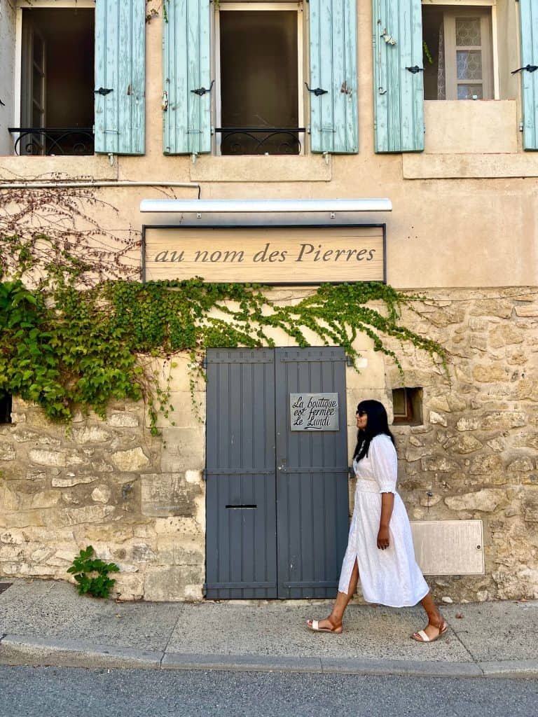 Beautiful villages to visit in Provence: Bejal walking past traditional house in Lourmarin