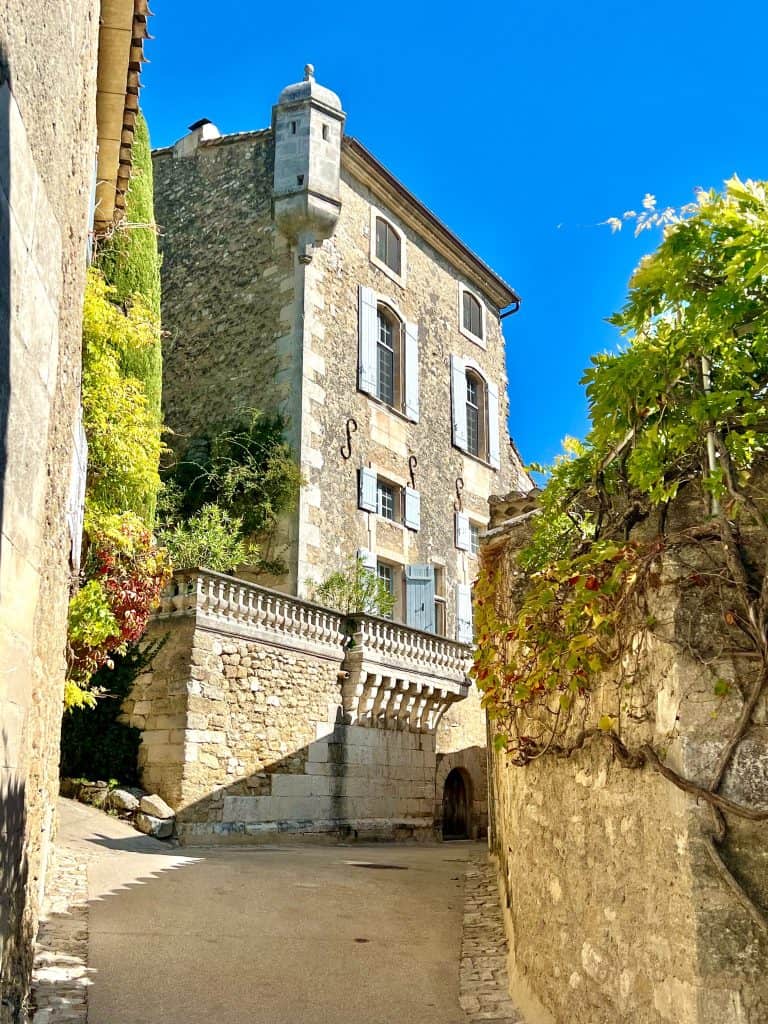 Beautiful Villages To Visit in Provence: Menerbes grand house view from lane