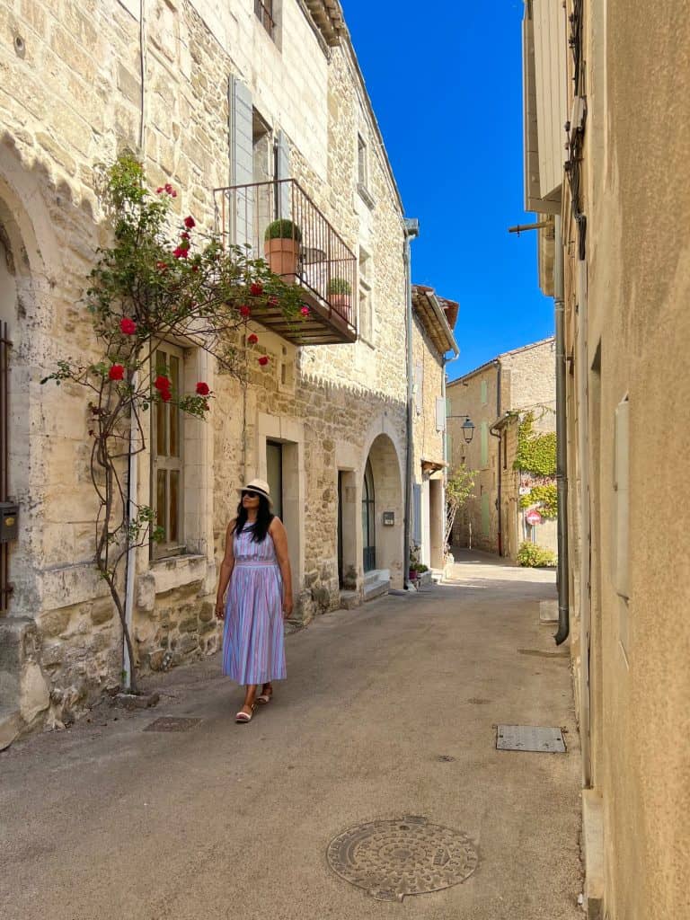 Bejal walking down cobbled stone lane in Lacoste