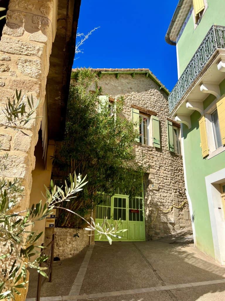 Pretty pastel and stone houses in Baumes de Venise