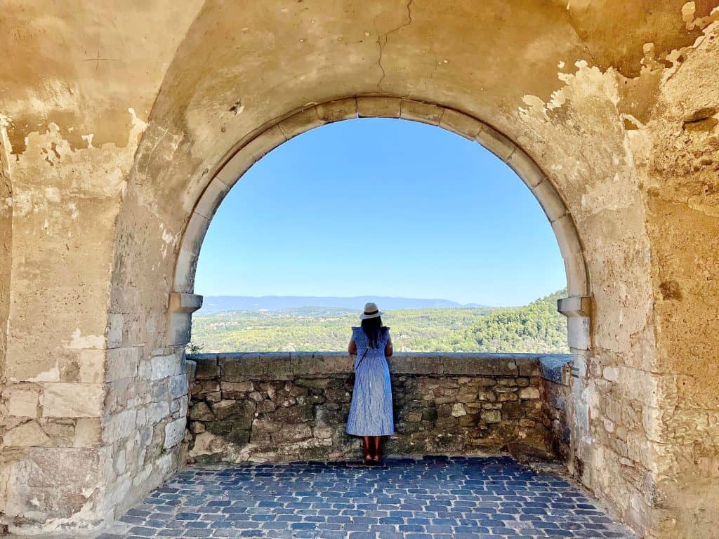 Beautiful Villages To Visit in Provence: bejal looking out over vineyards from view point in Menerbes