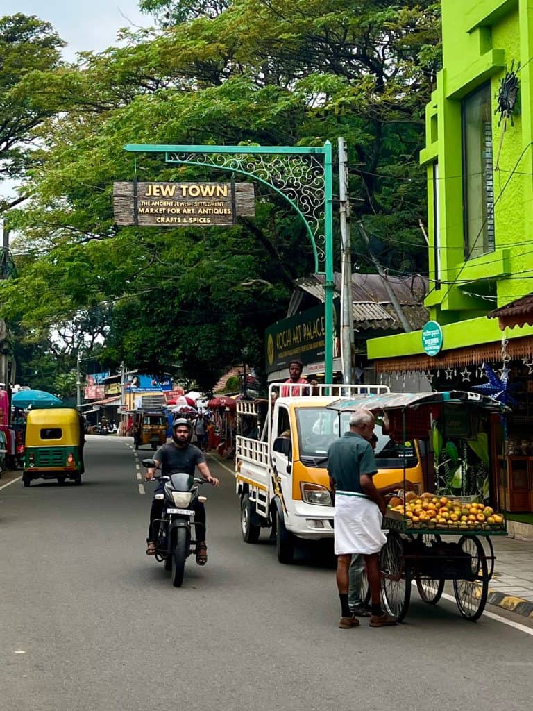 10 day Kerala itinerary, man on motorbike in Jew Town, Fort Kochi