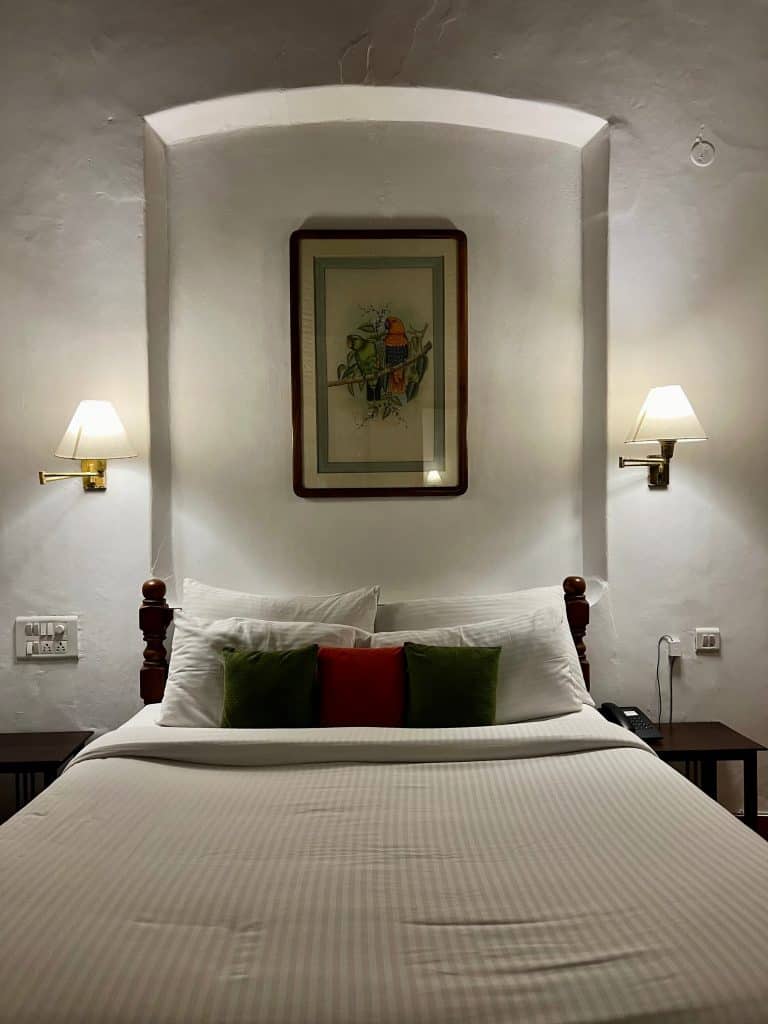 Eco-friendly Hotels in Kerala: Double bed in suite at Abad Dutch Bungalow