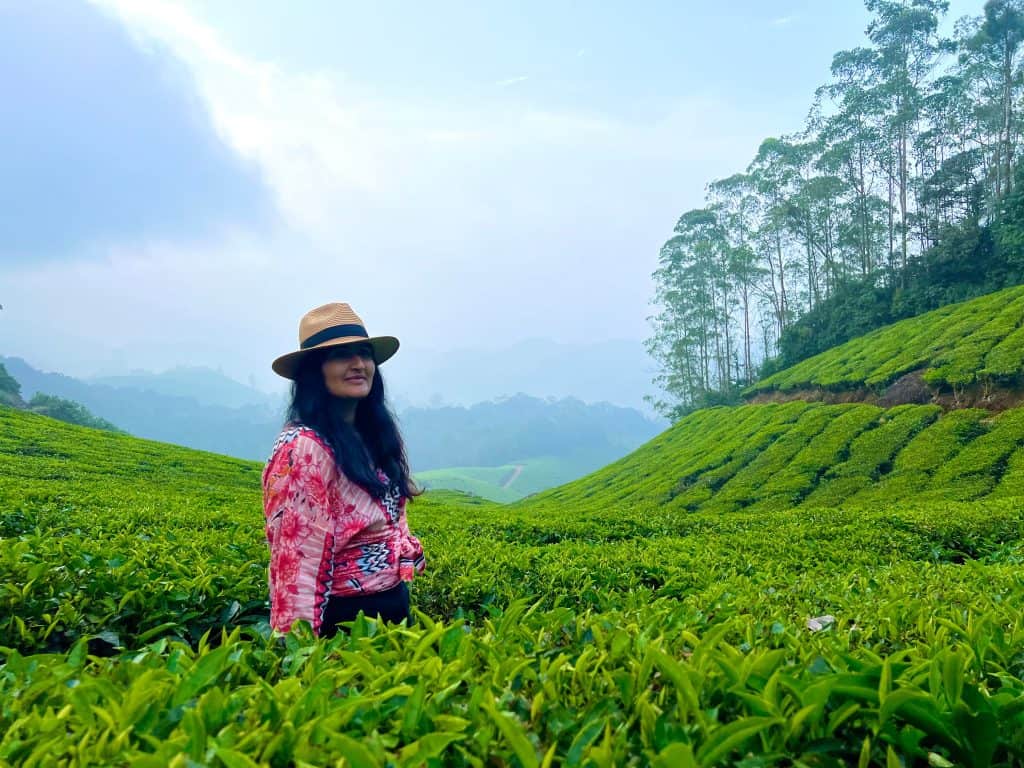 Bejal standing amongst tea plantation neighbouring Nature Zone Jungle Resort