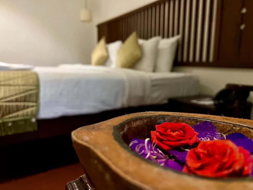Flower bowl with Bed in the background at Greenwoods Resort in Thekkady