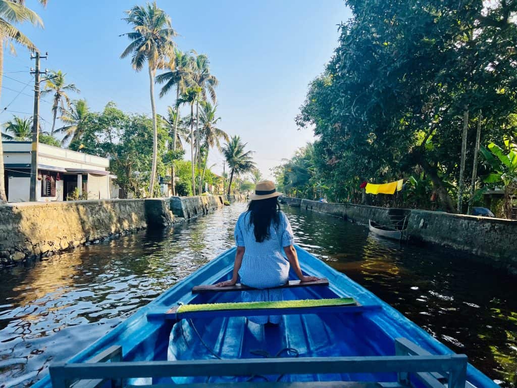 10 day Kerala Itinerary, Bejal sat on fishing boat down the smaller backwater canals in Alleppey