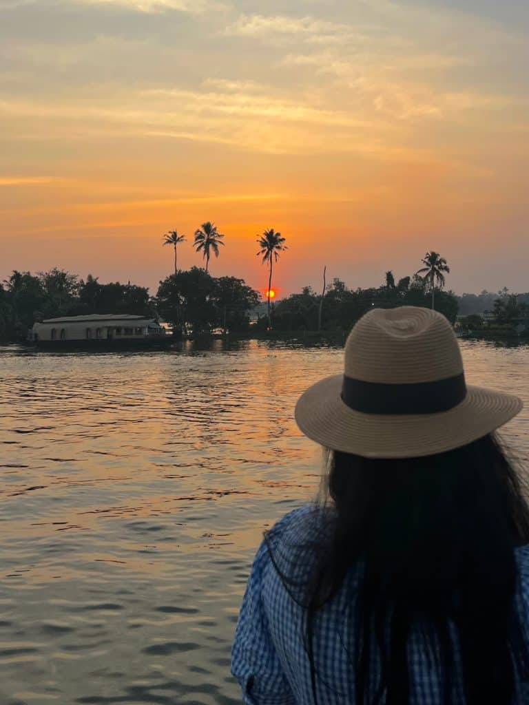 Bejal looking at sunset from top deck of Houseboat in Alleppey