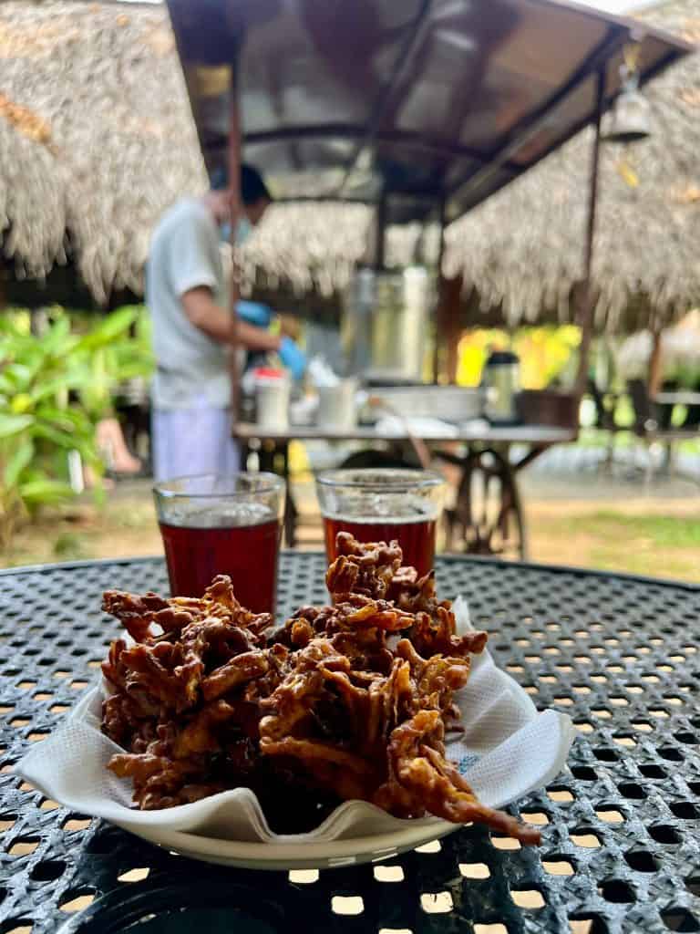 Tea and pakora snacks at tea stall at AbadTurtle Beach Resort, Marari