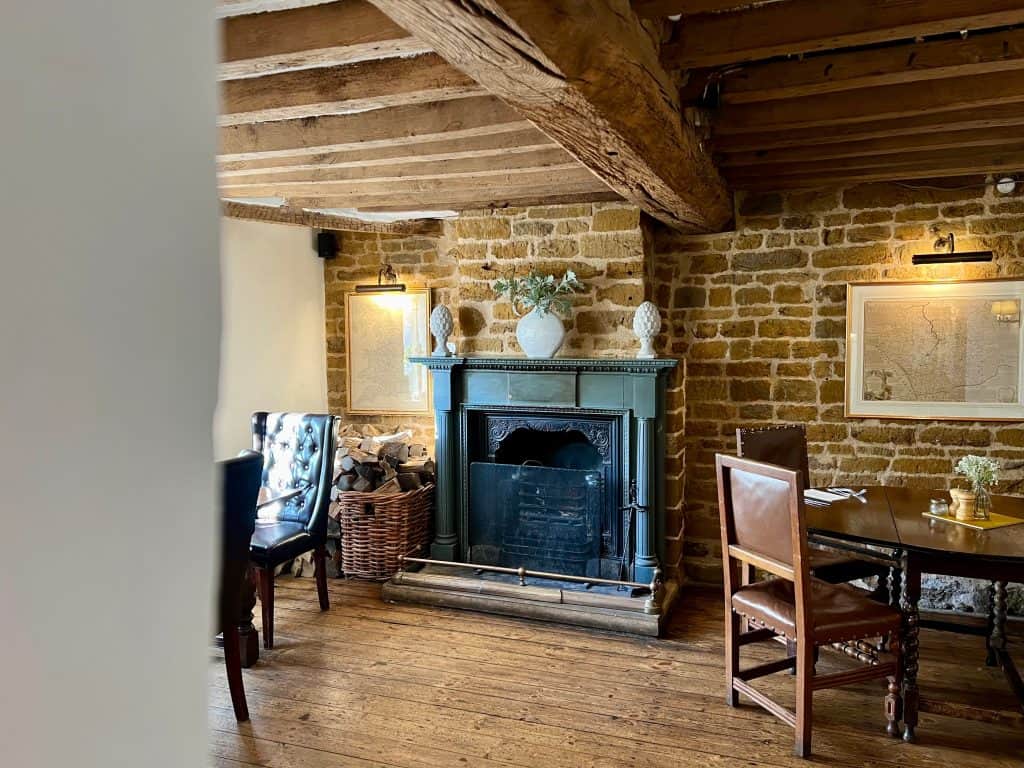 Indian Food & Rooms: The Marquess of Exeter: fireplace in room next to bar