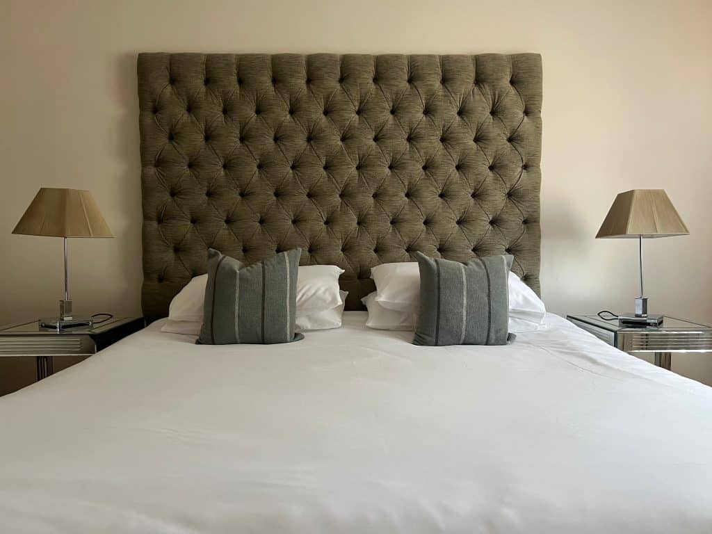 King bed with high buttoned head board