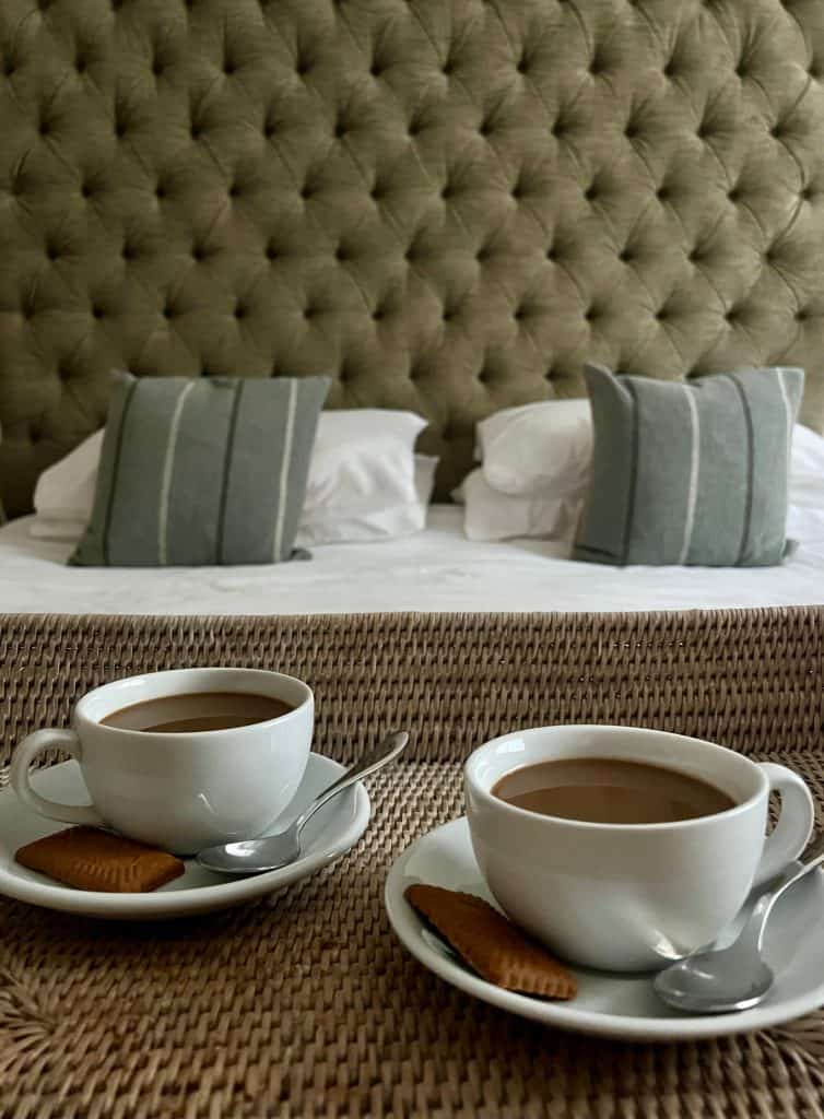 coffee cups in front of bed