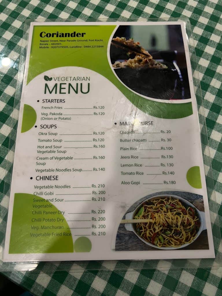 The green and white menu at Coriander restaurant in fort Kochi