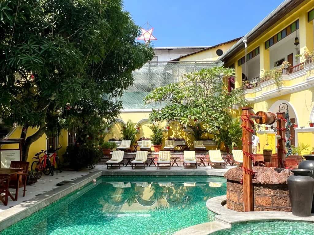 48 hours in Fort Kochi. Hotel Forte's courtyard with yellow painted walls adn swimming pool