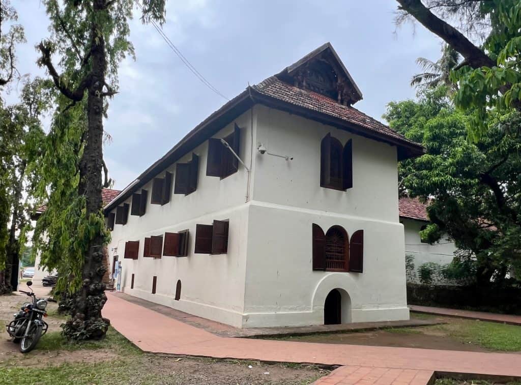 48 hours in Fort Kochi: The exterior white walls and brown shuttered windows of Mattancherry Palace