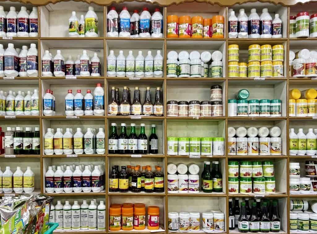 Things to do in Munnar: Indian Spices & Herbal Garden Ayurvedic shops with racks of lotions, creams and tablets.