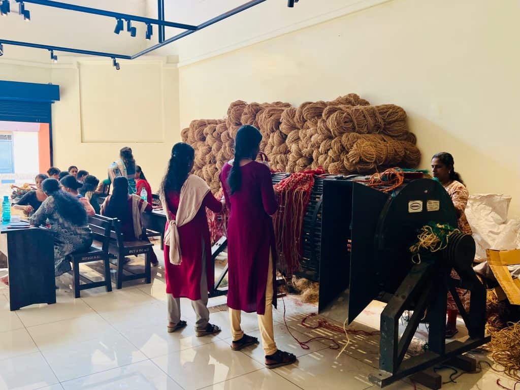 Ladies learning techniques in a coir class showing Kerala one of India's most eco-friendly states