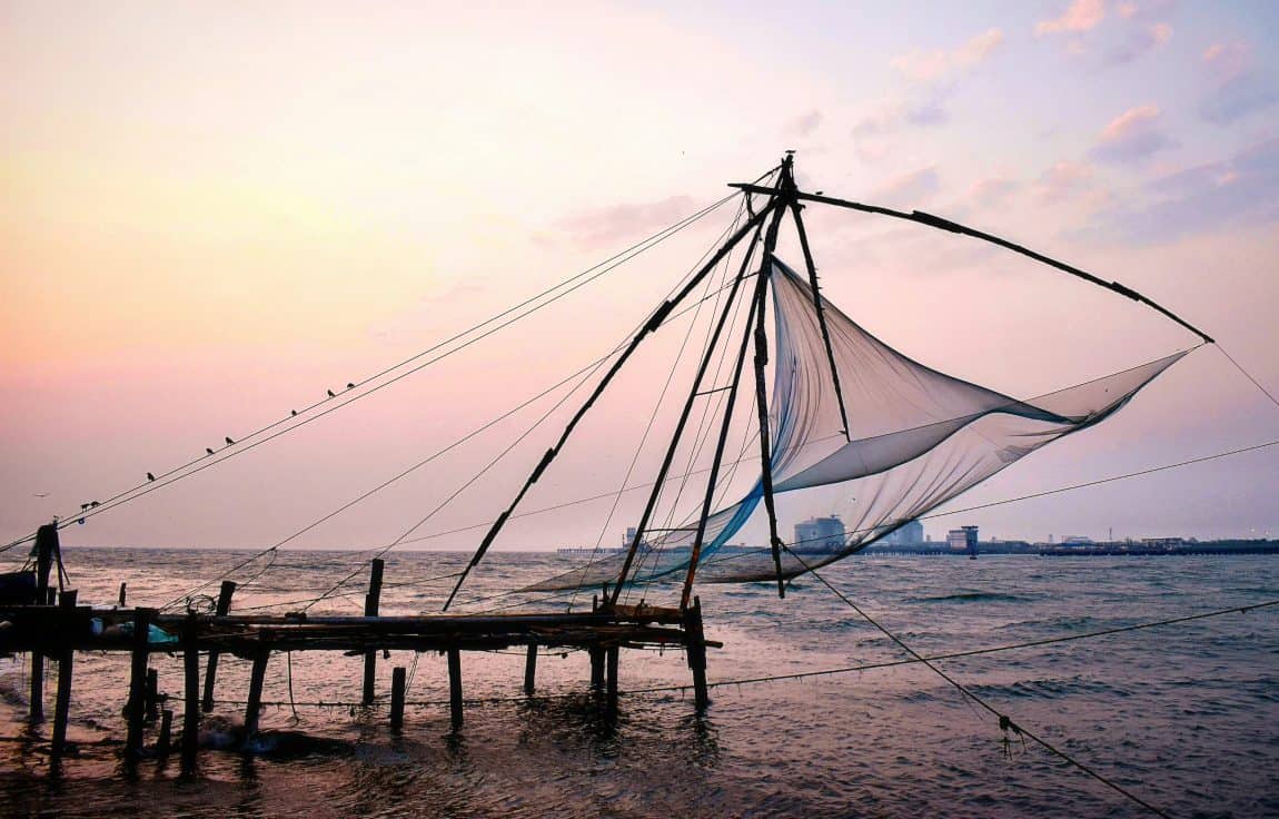 48 hours in Fort Kochi: Fishing nets with a sunset behind them at Fort Kochi Beach