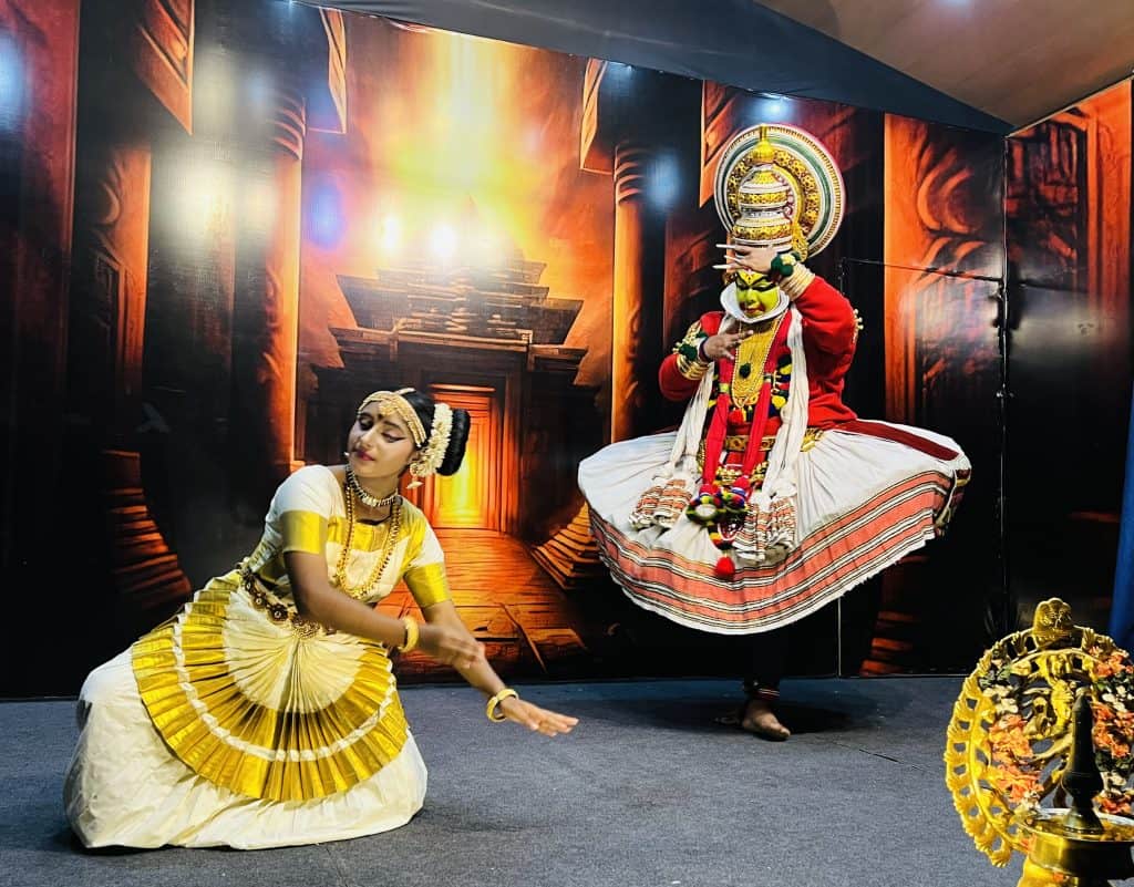 Male and female Kathakali dancers playing the roles of Lord Krishna and Radha in a performance at the Mudra Cultural Centre, Thekkady, Kerala