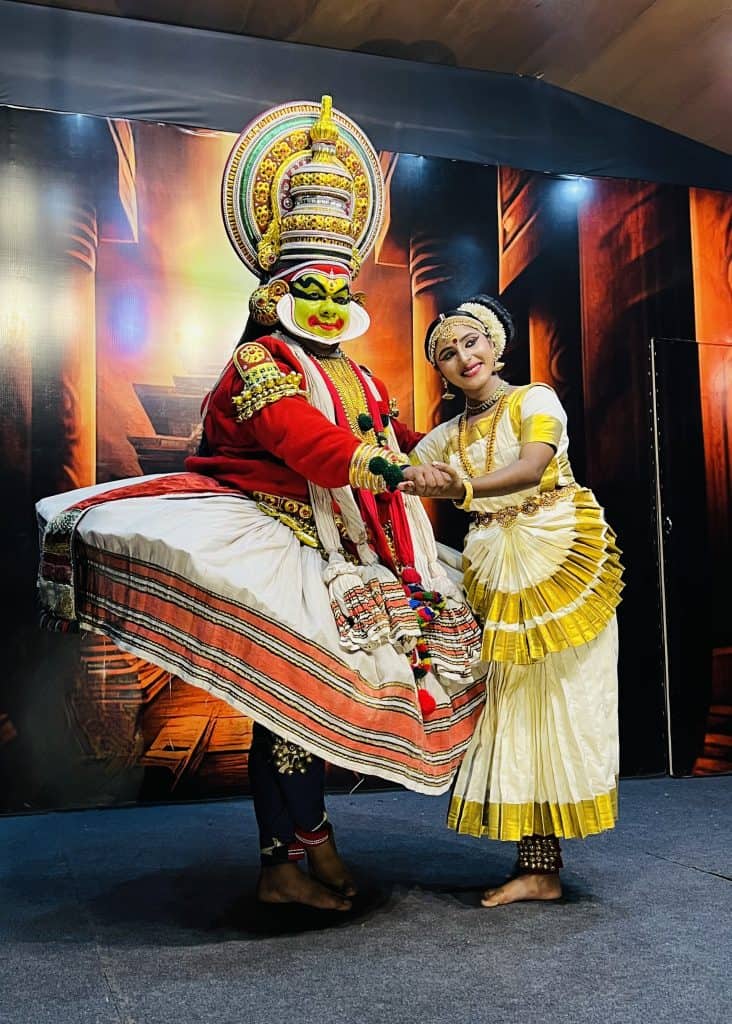 Male and female Kathakali dancers playing the roles of Lord Krishna and Radha in a performance at the Mudra Cultural Centre, Thekkady, Kerala