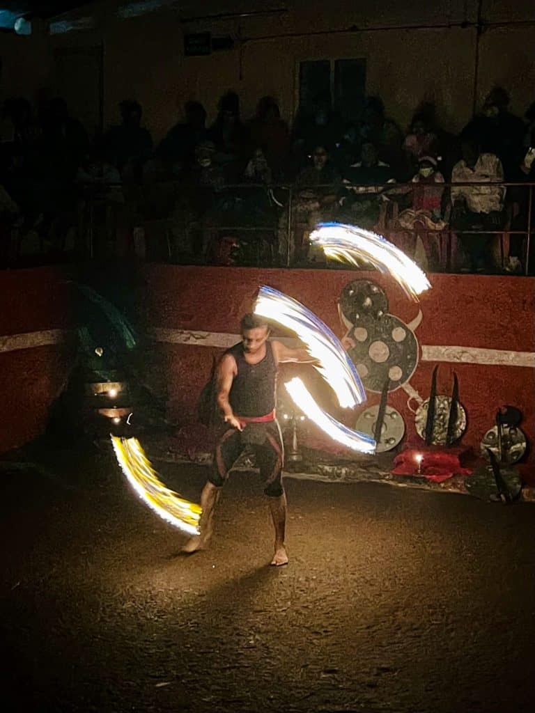 Things to do in Thekkady: Kalaripayattu show at The Mudra Centre and Kalaris using fire to show routine