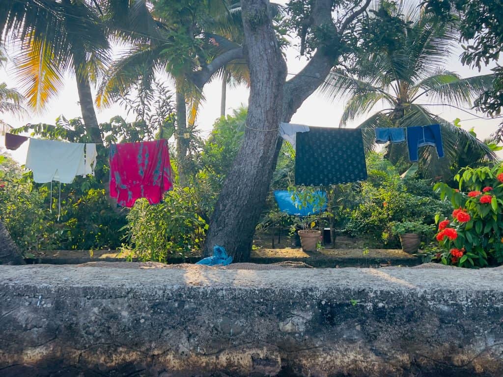 Beautiful Kerala backwaters: Washing drying on. aline on the banks of the small canal networjs .