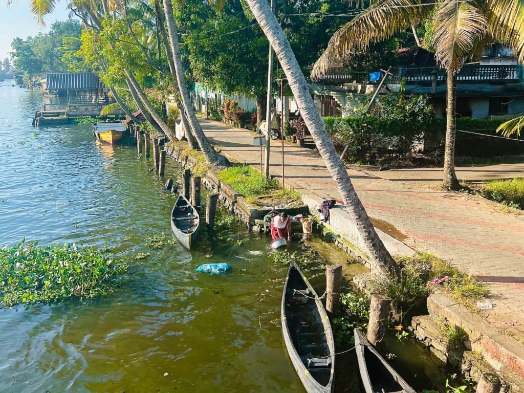 Beautiful Kerala Backwaters: women washing clothes near the bankso fthe backwaters in Alleppey.