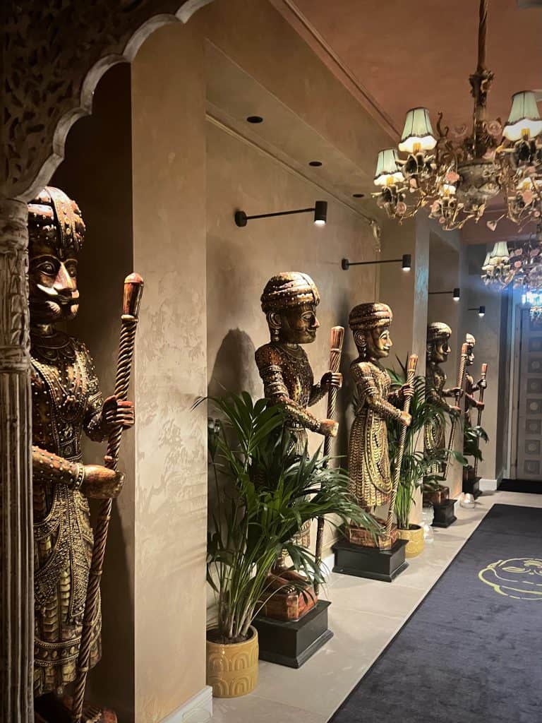 The Rajasthan men in a row at the entrance hall of Varansi, Leicester