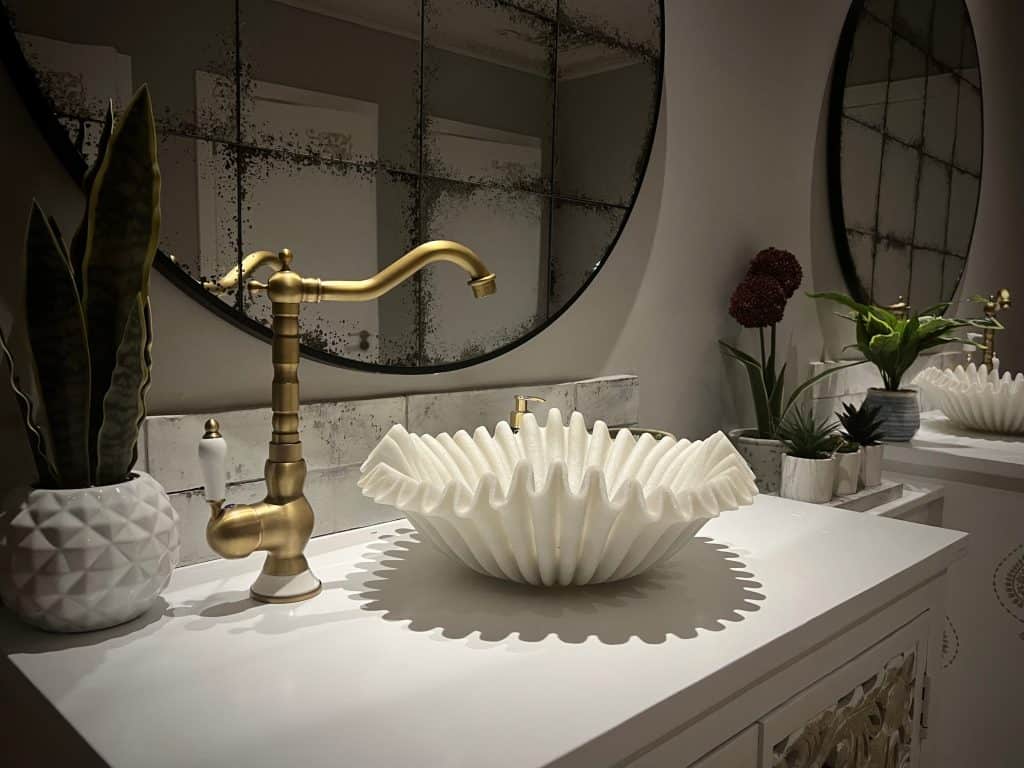 Indian Fine Dining At Varanasi: The white fluted bathroom sink and gold taps in the ladies bathroom.